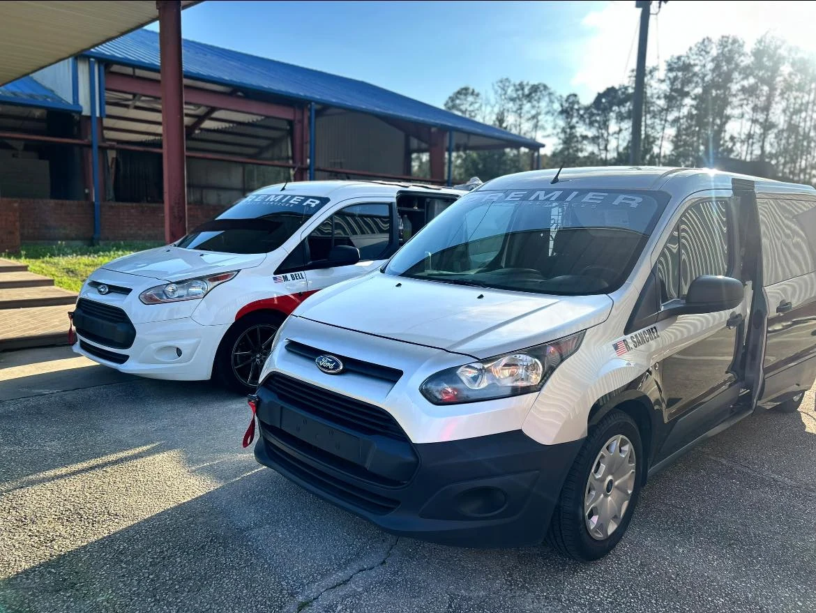 Premier Mobile Services branded detail vans